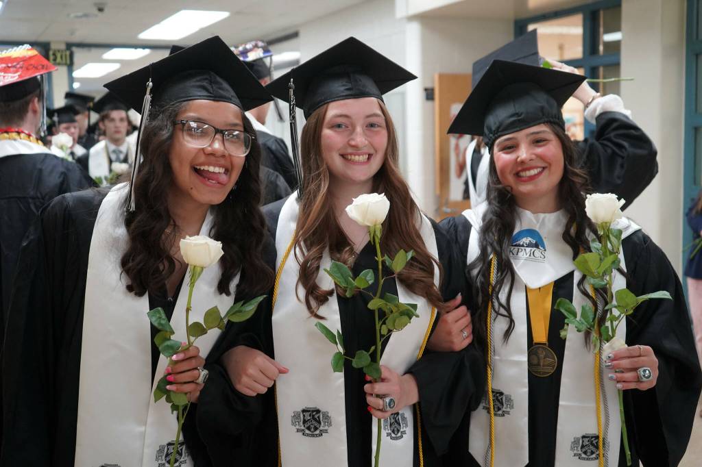 Nikiski graduates prepare to enter their graduation ceremony at Nikiski/Middle High School in Nikiski, Alaska, on Monday, May 19, 2025. (Jake Dye/Peninsula Clarion)