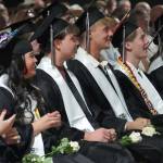 Nikiski graduates view their slideshow during a commencement ceremony at Nikiski/Middle High School in Nikiski, Alaska, on Monday, May 19, 2025. (Jake Dye/Peninsula Clarion)