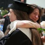 Nikiski graduates bring roses to their supporters during a commencement ceremony at Nikiski/Middle High School in Nikiski, Alaska, on Monday, May 19, 2025. (Jake Dye/Peninsula Clarion)