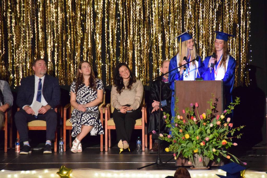 Brightly Thoning and Beatrix McDonough deliver their valedictorian and salutatorian address during the 2025 Homer High School graduation ceremony on Wednesday, May 21, 2025, in the Alice Witte Gymnasium. (Chloe Pleznac/Homer News)