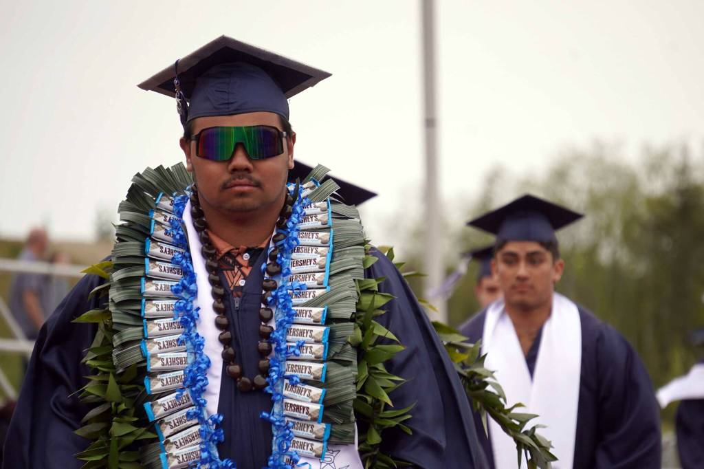 Graduates of Soldotna High School process into a commencement ceremony on the schools football field in Soldotna, Alaska, on Wednesday, May 21, 2025. (Jake Dye/Peninsula Clarion)