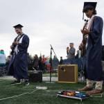 Sam Klein and Harold Rudstrom perform the national anthem during Soldotna High Schools graduation ceremony on the schools football field in Soldotna, Alaska, on Wednesday, May 21, 2025. (Jake Dye/Peninsula Clarion)