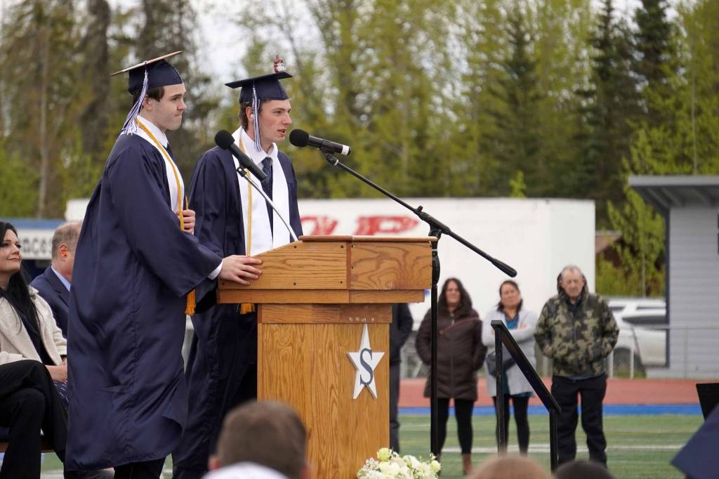 Valedictorian Scott Powell and Salutatorian James Innes deliver an address during the Soldotna High School graduation ceremony on the schools football field in Soldotna, Alaska, on Wednesday, May 21, 2025. (Jake Dye/Peninsula Clarion)