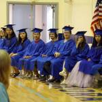 Kenai Alternative High School graduates take their seats during a commencement ceremony in the schools gym in Kenai, Alaska, on Wednesday, May 22, 2025. (Jake Dye/Peninsula Clarion)
