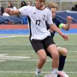 Kenai Centrals Brett Goldsby shields the ball from Soldotnas Owen Buckbee on Thursday, May 22, 2025, at Justin Maile Field at Soldotna High School in Soldotna, Alaska. (Photo by Jeff Helminiak/Peninsula Clarion)
