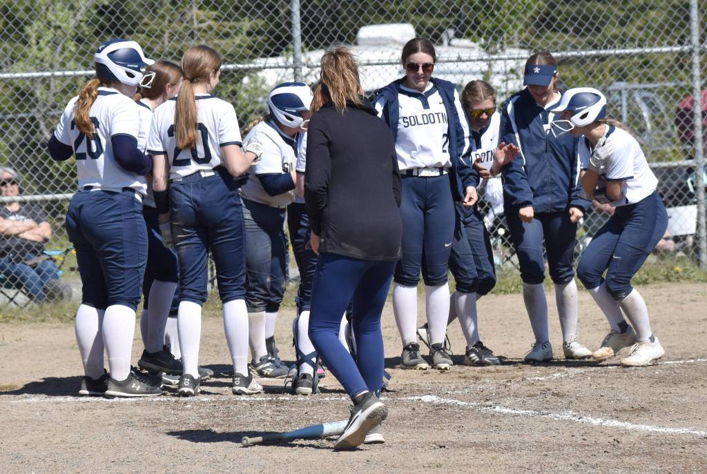 Soldotna celebrates a home run by Tatum Cooper (far right) on Saturday, May 24, 2025, at the Soldotna Little League fields in Soldotna, Alaska. (Photo by Jeff Helminiak/Peninsula Clarion)