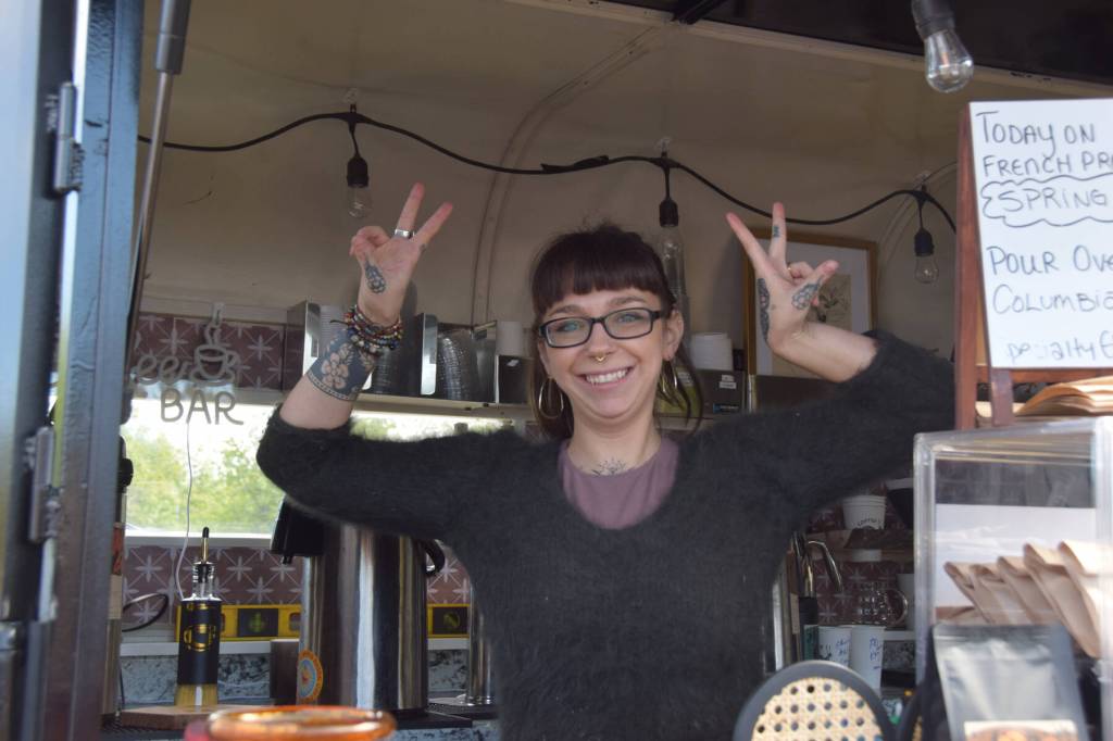 Sierra Moskios-Schlieman of Fika Coffee Roasters poses for a photo in their new coffee trailer during the first Homer Farmers Market of the 2025 season on Saturday, May 24. (Chloe Pleznac/Homer News)