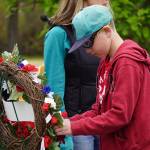 Poppies are affixed to memorial wreathes during a Memorial Day service at Leif Hansen Memorial Park in Kenai, Alaska, on Monday, May 26, 2025. (Jake Dye/Peninsula Clarion)