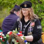 Poppies are affixed to memorial wreathes during a Memorial Day service at Leif Hansen Memorial Park in Kenai, Alaska, on Monday, May 26, 2025. (Jake Dye/Peninsula Clarion)