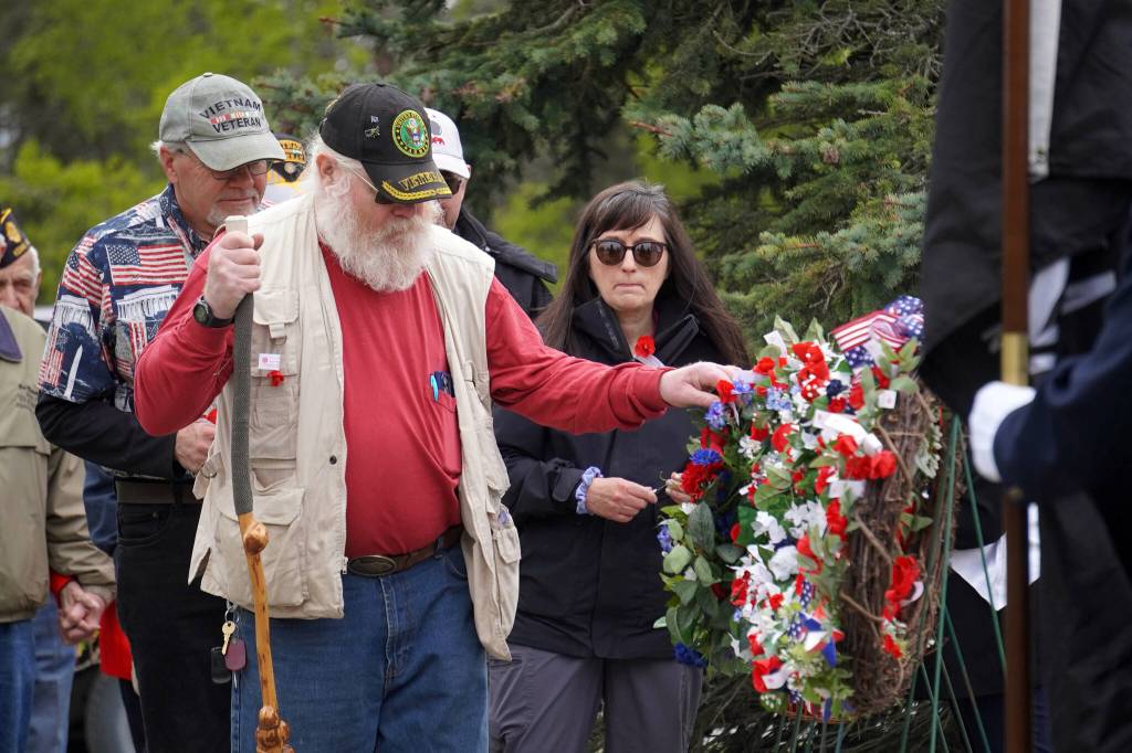 Poppies are affixed to memorial wreathes during a Memorial Day service at Leif Hansen Memorial Park in Kenai, Alaska, on Monday, May 26, 2025. (Jake Dye/Peninsula Clarion)