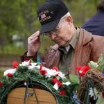 Poppies are affixed to memorial wreathes during a Memorial Day service at Leif Hansen Memorial Park in Kenai, Alaska, on Monday, May 26, 2025. (Jake Dye/Peninsula Clarion)
