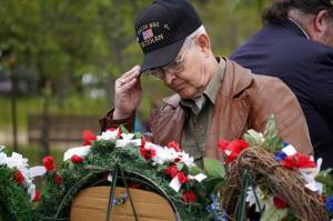 Poppies are affixed to memorial wreathes during a Memorial Day service at Leif Hansen Memorial Park in Kenai, Alaska, on Monday, May 26, 2025. (Jake Dye/Peninsula Clarion)