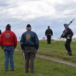 VFW Post 10221 member Eric Henley performs the battlefield cross at the American Legion Cemetery in Ninilchik, Alaska on Monday, May 26, 2025. (Delcenia Cosman/Homer News)