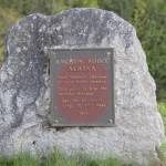 One of the original plaques, dated 1971, marks Mile 157 in Anchor Point, Alaska, as the most westerly highway point in North America. (Delcenia Cosman/Homer News)