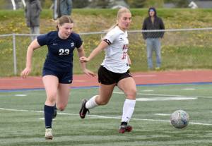 Soldotnas Jillian Duncan and Kenai Centrals Kate Wisnewski battle for the ball Thursday, May 22, 2025, at Justin Maile Field at Soldotna High School in Soldotna, Alaska. (Photo by Jeff Helminiak/Peninsula Clarion)