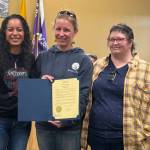 Winter Marshall-Allen of the Homer Organization for More Equitable Relations, Homer Mayor Rachel Lord, and Jerrina Reed of Homer PRIDE pose for a photo after the mayoral proclamation recognizing June as Pride Month on Tuesday, May 27 at the Cowles Council Chambers. (Photo courtesy of Winter Marshall-Allen)