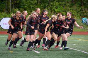 The Kenai Central High School girls celebrate their first goal, by Brynnen Hanson, during the final match of the ASAA Division II Girls Soccer Championship at Wasilla High School in Wasilla, Alaska, on Saturday, May 31, 2025. (Jake Dye/Peninsula Clarion)