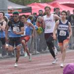 Soldotnas Tyce Escott wins the 200-meter dash in a driving rain Saturday, May 31, 2025, at the Division I state track meet at Dimond High School in Anchorage, Alaska. (Photo by Jeff Helminiak/Peninsula Clarion)