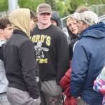Soldotna head coach Phil Leck talks with his team after the Stars won the boys team title Saturday, May 31, 2025, at the Division I state track meet at Dimond High School in Anchorage, Alaska. (Photo by Jeff Helminiak/Peninsula Clarion)