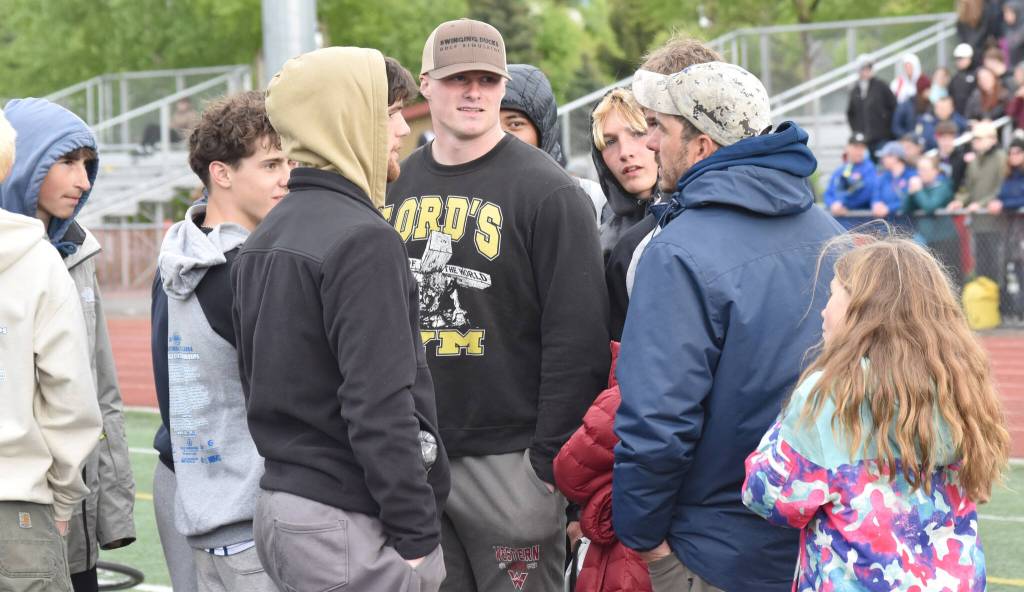 Soldotna head coach Phil Leck talks with his team after the Stars won the boys team title Saturday, May 31, 2025, at the Division I state track meet at Dimond High School in Anchorage, Alaska. (Photo by Jeff Helminiak/Peninsula Clarion)