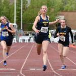 Homers Gracie Miotke wins the 100-meter dash Saturday, May 31, 2025, at the Division II state track meet at Dimond High School in Anchorage, Alaska. (Photo by Jeff Helminiak/Peninsula Clarion)