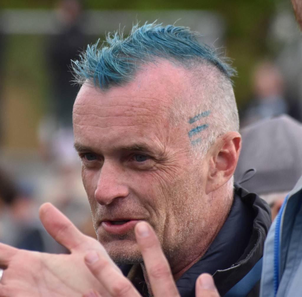 Homers Bob Ostrom, seen Saturday, May 31, 2025, at the Division II state track meet at Dimond High School in Anchorage, Alaska, had to cut his hair due to all the school records his team has broken this season. (Photo by Jeff Helminiak/Peninsula Clarion)