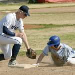 Monroe Catholics Charlie Menard slides in safely in front of Soldotnas Jayden Stuyvesant at the Division II state baseball tournament at Coral Seymour Memorial Park in Kenai, Alaska, on Friday, June 6, 2025. (Photo by Jeff Helminiak/Peninsula Clarion)