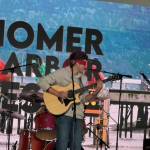 Local musician Silas Luke Jones performs blindfolded during his performance at the inaugeral HomerFest on the Homer Spit in Homer, Alaska on Saturday, June 7, 2025. (Chloe Pleznac/Homer News)