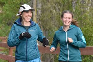 Soldotna's Kristin Davis and Ruby Davis lead Kenai's Rustin Hitchcock at the Tsalteshi Backyard Ultra on Friday, June 6, 2025, in Soldotna, Alaska. (Photo by Jeff Helminiak/Peninsula Clarion)