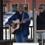 Cindy McKenna performs her song “It’s My Flag Too," on Friday, June 6, 2025 at WKFL Park in Homer, Alaska. (Chloe Pleznac/Homer News)
