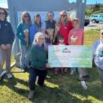 The Sweaty Bettys donate their $300 prize for second place in this years Homer Steps Up walking challenge to Kachemak Bay Recovery Connection during the celebration on June 5, 2025, in Homer, Alaska. Photo provided by South Peninsula Hospital