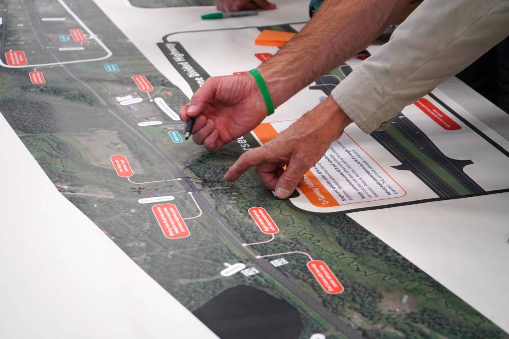 Leads for the Sterling Safety Corridor Improvements Project field questions and showcase their preferred design during an open house meeting at the Soldotna Regional Sports Complex in Soldotna, Alaska, on Tuesday, June 10, 2025. (Jake Dye/Peninsula Clarion)