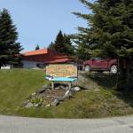 The Homer Senior Citizens Inc. sign, illuminated by sunlight on June 12. (Chloe Pleznac/Homer News)