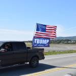 Cars and trucks adorned with flags drive down the Homer Spit Road on Saturday, June 14, 2025 in Homer, Alaska. The processional was in honor of Flag Day and the 250th anniversary of the U.S. Army being formed. (Chloe Pleznac/Homer News)