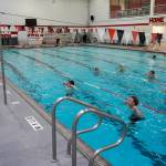 Pool manager and swim coach Will Hubler leads a treading water exercise at Kenai Central High School in Kenai, Alaska, on Tuesday, June 17, 2025. (Jake Dye/Peninsula Clarion)