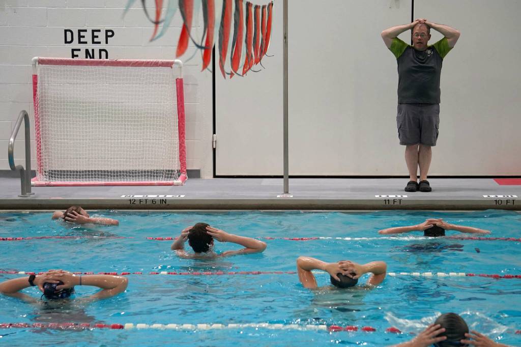 Pool manager and swim coach Will Hubler leads a treading water exercise at Kenai Central High School in Kenai, Alaska, on Tuesday, June 17, 2025. (Jake Dye/Peninsula Clarion)