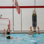 Pool manager and swim coach Will Hubler leads a treading water exercise at Kenai Central High School in Kenai, Alaska, on Tuesday, June 17, 2025. (Jake Dye/Peninsula Clarion)