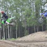 Ricky Bailey (901) of Wasilla and Aaron Loyer (396) of Palmer race in the pro class at the Alaska State Motocross Series Race 4 on Sunday, June 15, 2025, at Twin City Raceway in Kenai, Alaska. Bailey and Loyer grew up racing at the raceway. (Photo by Jeff Helminiak/Peninsula Clarion)