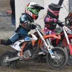 Davis Loyer of Palmer and Camryn Kelly of Soldotna race 50 intermediate at the Alaska State Motocross Series Race 4 on Sunday, June 15, 2025, at Twin City Raceway in Kenai, Alaska. (Photo by Jeff Helminiak/Peninsula Clarion)