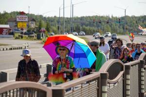 A Pride march moves along the Sterling Highway through Soldotna, Alaska, on Saturday, June 24, 2025. (Jake Dye/Peninsula Clarion)