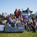 Pride celebrants pose for a photo at Soldotna Creek Park in Soldotna, Alaska, on Saturday, June 14, 2025. (Jake Dye/Peninsula Clarion)