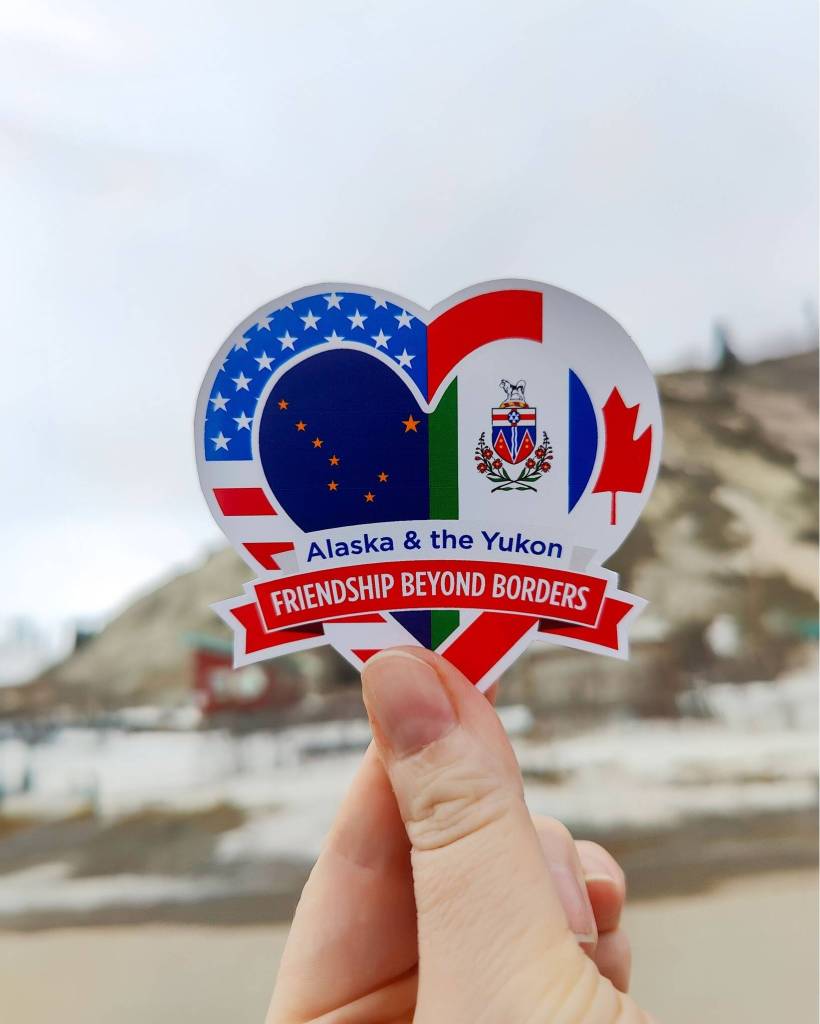 The Skagway Visitor Department created a sticker to share love for the Yukon. For upcoming special events, the first 100 attendees and volunteers will receive a free friendship sticker, and all Skagway Marathon Racers will also receive one. (Photo courtesy of Jaime Bricker)