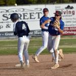 Second baseman Micah Austin of Madisonville (Kentucky) Post 6 turns a doube play in front of Hunter Carte of Auke Bay Post 25 on Friday, June 20, 2025, in the Lance Coz Wood Bat Tournament at Coral Seymour Memorial Park in Kenai, Alaska. Carte was called for interference on the play. (Photo by Jeff Helminiak/Peninsula Clarion)