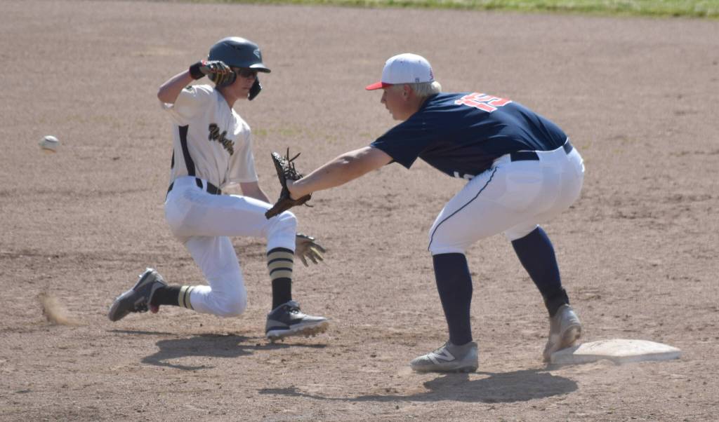 Will Preston of South Post 4 is doubled up by Jayden Stuyvesant of the Post 20 Twins on Friday, June 20, 2025, in the Lance Coz Wood Bat Tournament at Coral Seymour Memorial Park in Kenai, Alaska. (Photo by Jeff Helminiak/Peninsula Clarion)