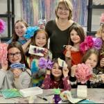 Sharlene Cline poses with her students during the final day of her recent art camp at Homer Council on the Arts, on Thursday, March 16, 2023. Top row, left to right, Isabel Piek, Autumn Smith, Eliana Cope, Lila Shavelson. (Christina Whiting/Homer News file)