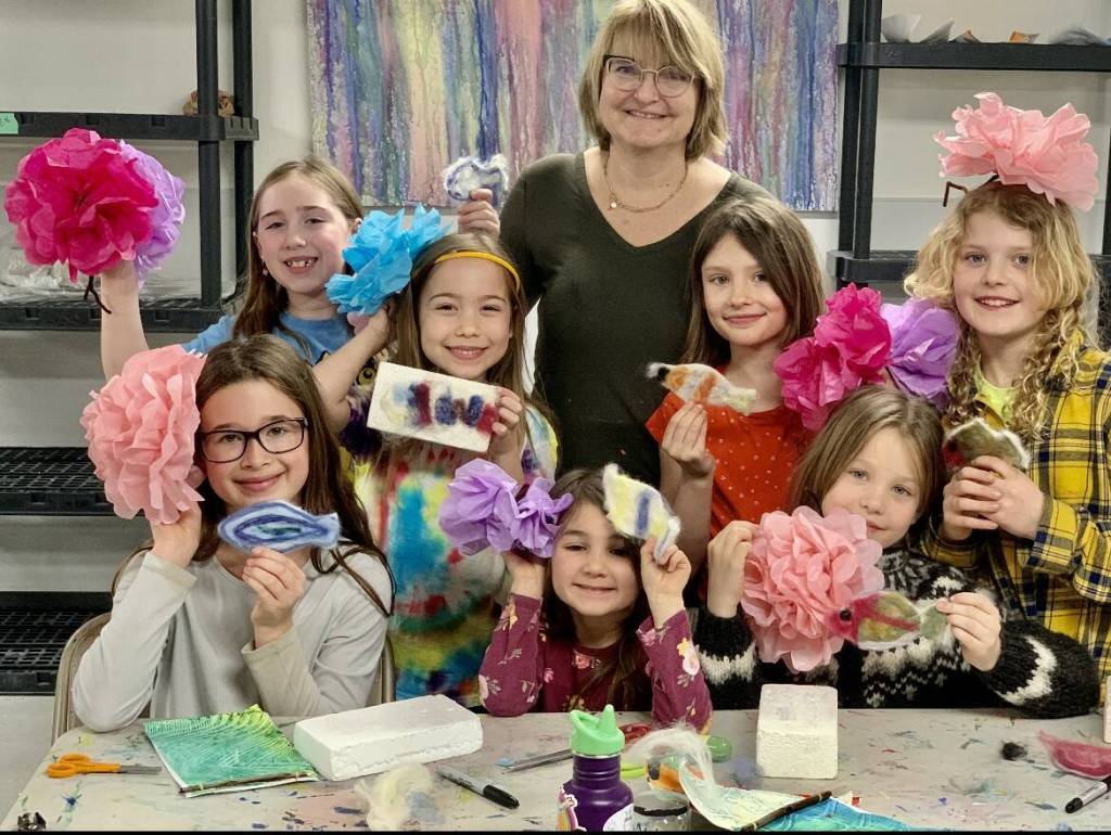 Sharlene Cline poses with her students during the final day of her recent art camp at Homer Council on the Arts, on Thursday, March 16, 2023. Top row, left to right, Isabel Piek, Autumn Smith, Eliana Cope, Lila Shavelson. (Christina Whiting/Homer News file)