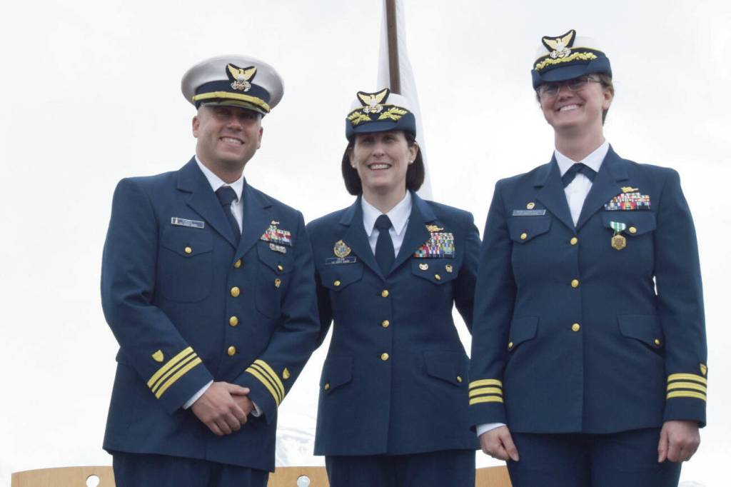Commanding Officer Corey Engel, Rear Adm. Megan Dean, and former ASPEN Commanding Officer Shea Winterberger smile for a photograph during the Change of Command ceremony on Thursday, June 26, 2025, on the Homer Spit in Homer, Alaska. (Chloe Pleznac/Homer News)