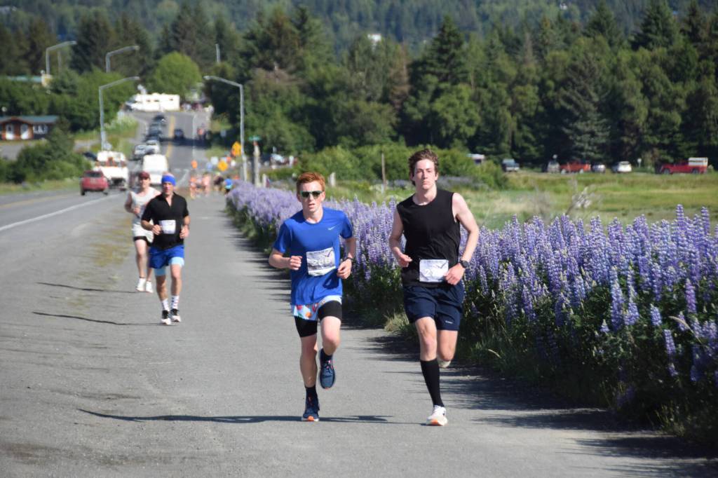 Charlie Rustand and Landon Tinsley run along the Homer Spit Trail during the Homer Spit Run 10K to the Bay on Saturday, June 28, 2025, in Homer, Alaska. (Delcenia Cosman/Homer News)