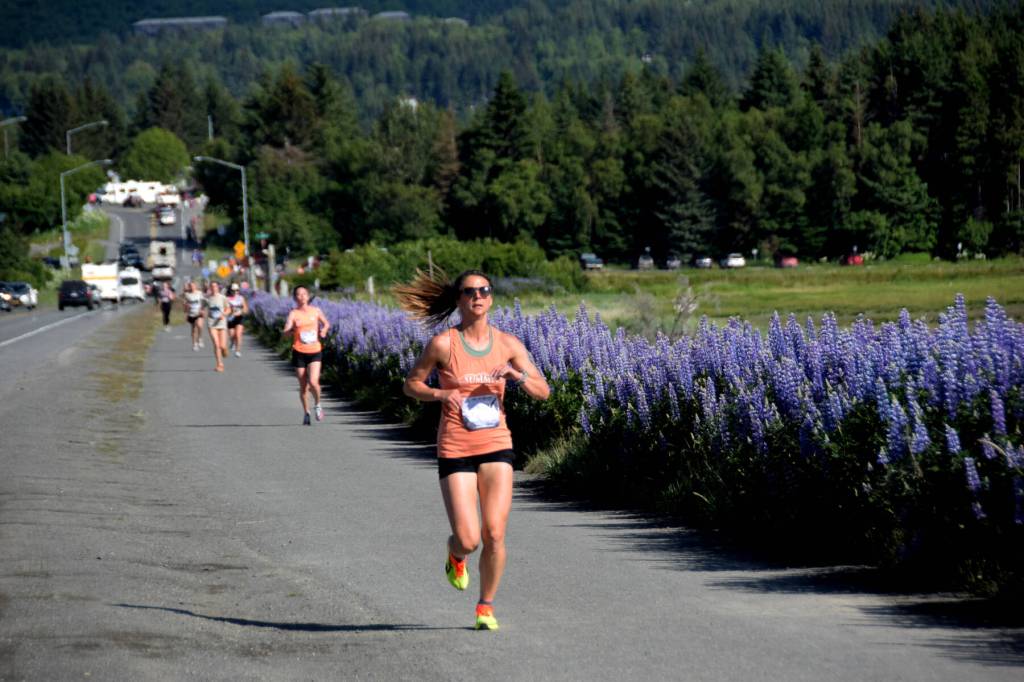 Amanda Cherok, competing in the Homer Spit Run 10 to the Bay on Saturday, June 28, 2025, runs along the Homer Spit Trail towards the finish line near Lands End Resort in Homer, Alaska. Cherok finished first in the womens category for the 10K race. (Delcenia Cosman/Homer News)