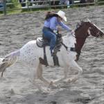Homers Jade Jones, with her horse keeping to the purple theme of the rodeo, competes in Open Barrels on Saturday, June 28, 2025, in the second Soldotna Equestrian Association rodeo of the year at the Soldotna Rodeo Grounds in Soldotna, Alaska. (Photo by Jeff Helminiak/Peninsula Clarion)
